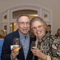 Two event guests smiling and posing for photo